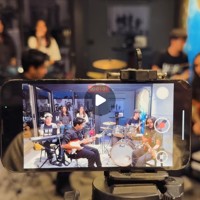 Meraki rehearsal viewed through a phone camera